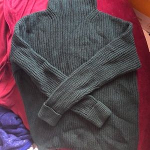 A dark green sweater